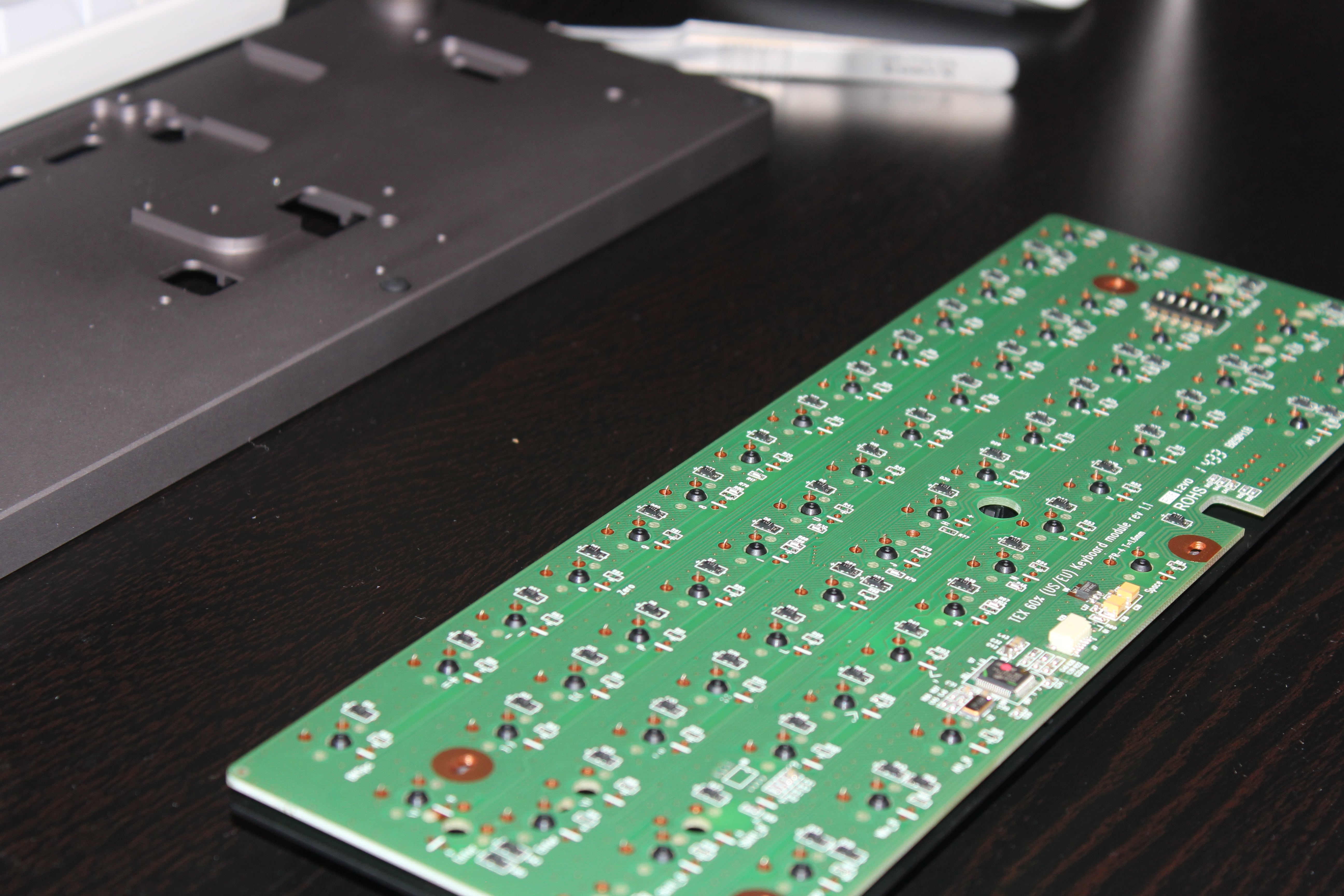 Cherry MX Clear Switches applied onto the TEX Yoda plate with the circuit board placed on top